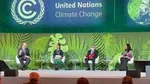 Alan Jope sits far left on stage at the World Leaders Summit during COP26, the climate change summit in Glasgow